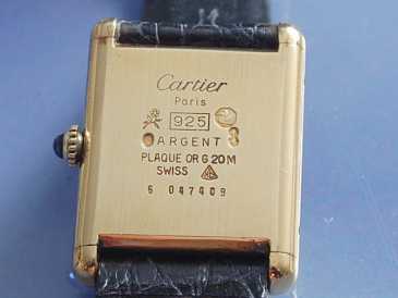 Фотоий: надувательство вахты женщины - CARTIER - TANK