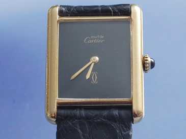 Фотоий: надувательство вахты женщины - CARTIER - TANK