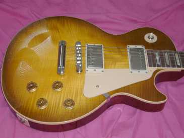 Фотоий: надувательство гитары и другие аппаратуры шнура GIBSON - LES PAUL STANDARD HONEY BURST DE 2005