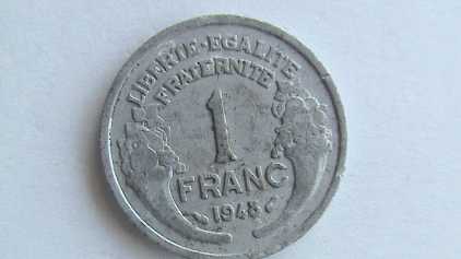 Фотоий: надувательство монетки UN FRANC 1948
