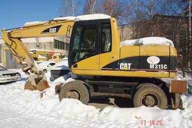 Фотоий: надувательство машины CATERPILLAR - M315C
