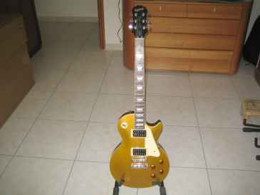 Фотоий: надувательство гитары и другие аппаратуры шнура EPIPHONE - GOLD TOP