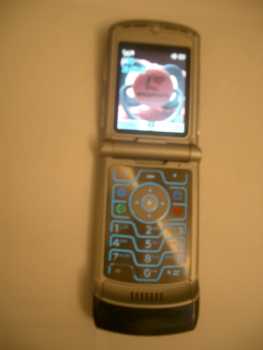 Фотоий: надувательство телефоны клетки MOTOROLA - V3